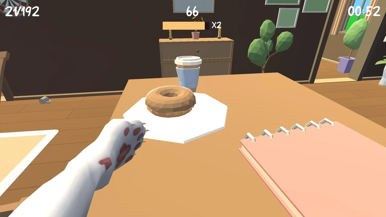 猫の手がドーナツとコーヒーカップのあるテーブルを向くゲーム画面